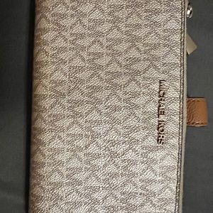 Gold Michael Kors wallet.